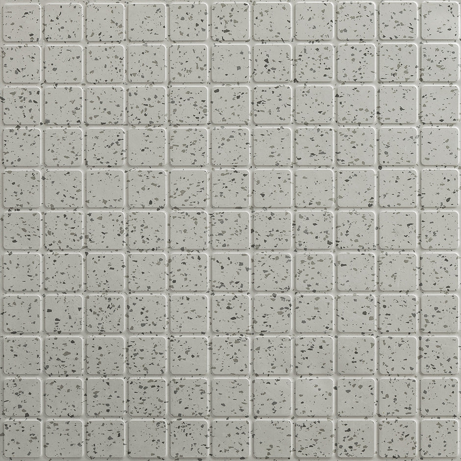 Close-up of speckled light gray rubber tile squares with subtle black flecks from the ColorScape collection